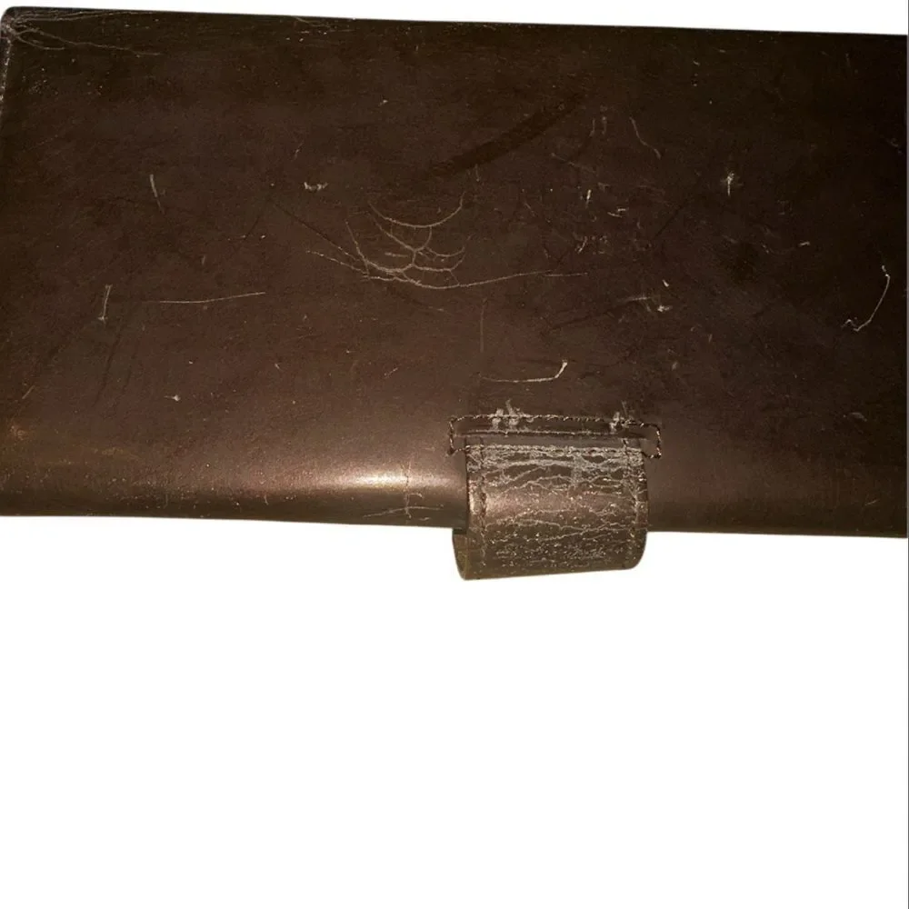Yves Saint Laurent Tan Leather Wallet with Gold Clasp with marks and scratches.